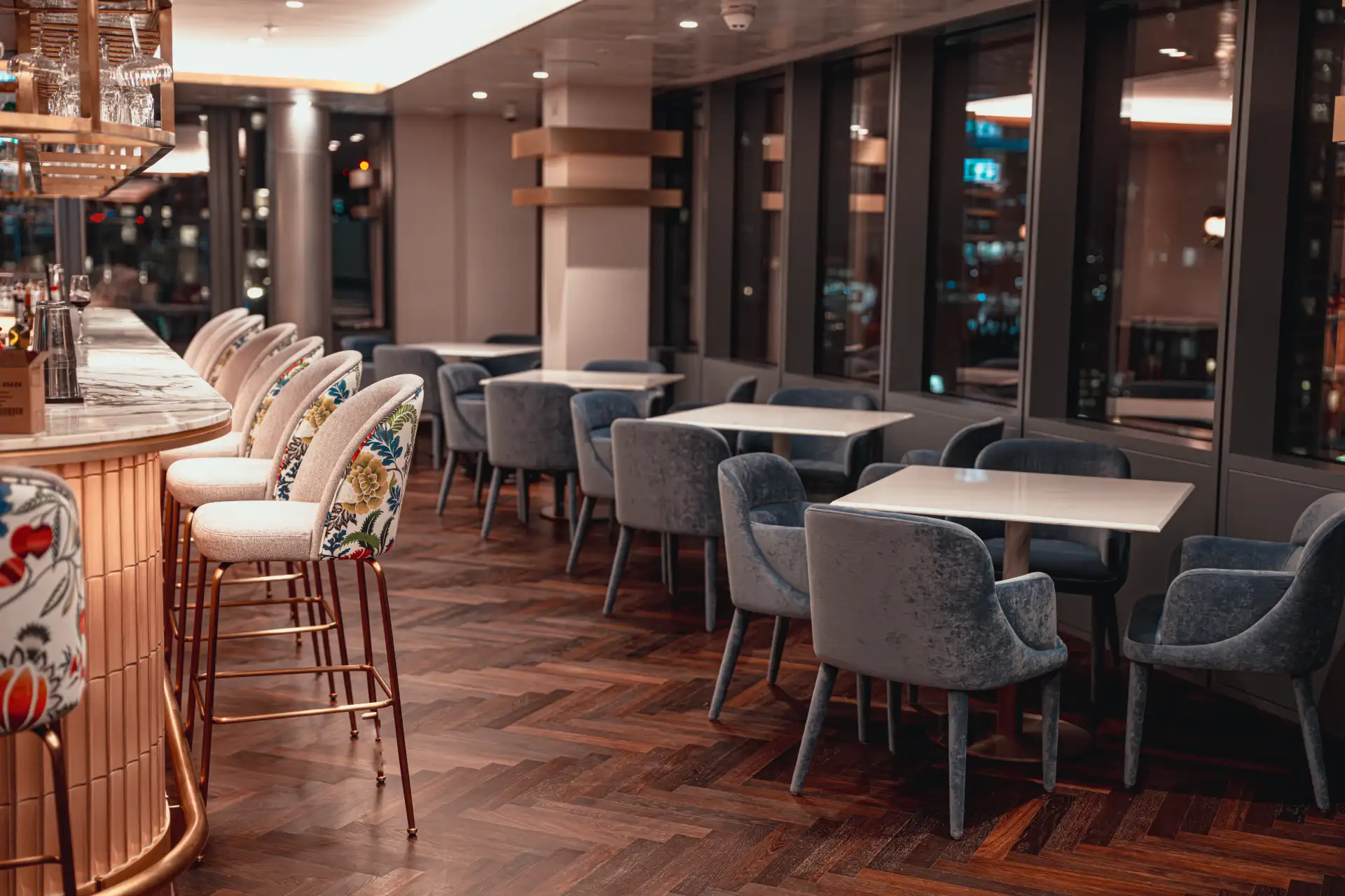 The bar area with elegant seating and city views